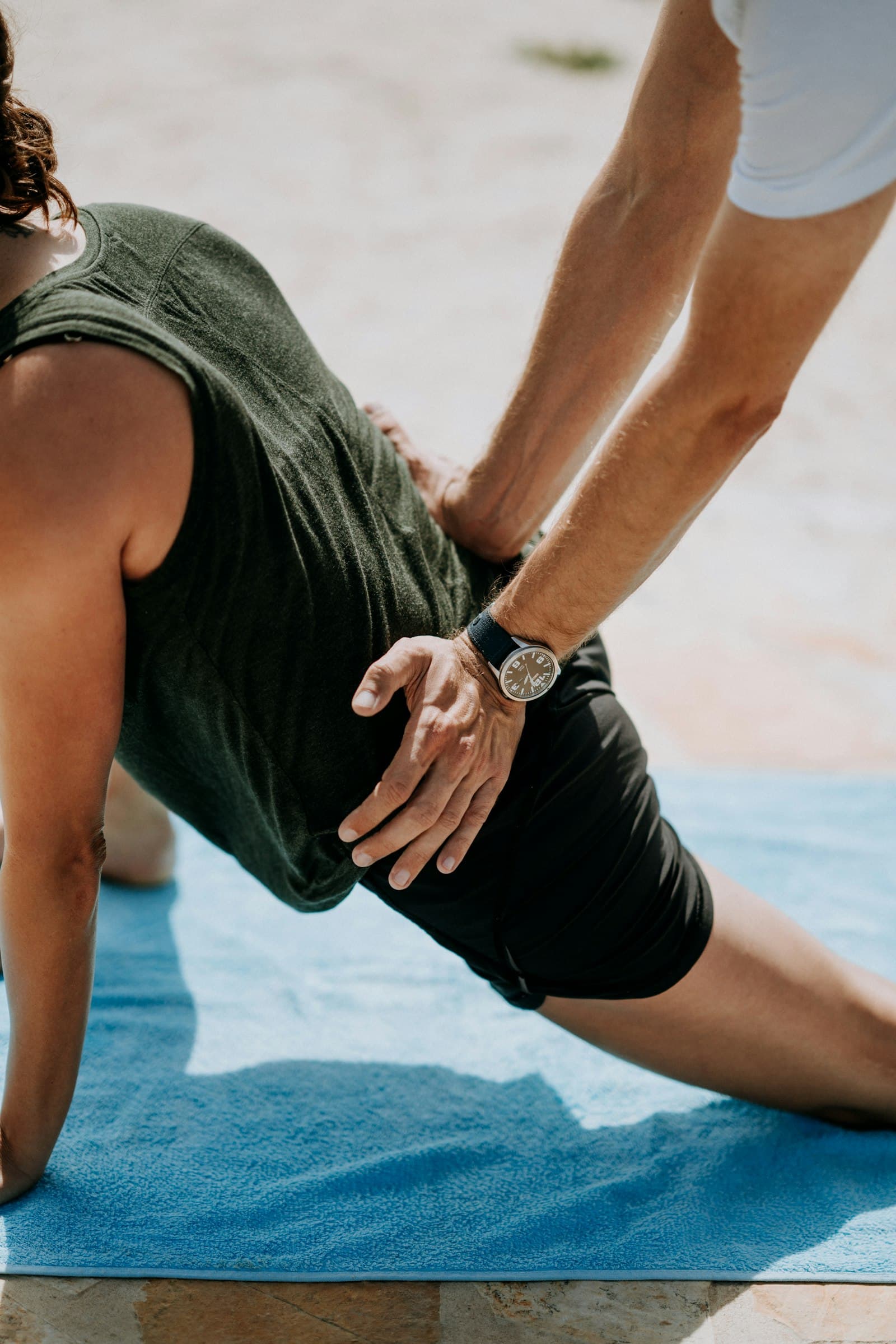 A therapist guiding a patient through a mobility movement
